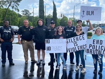 Groups in Millbrook Peacefully Protest; Police Respond with Water, Smiles